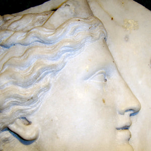 French carved marble relief of classical woman